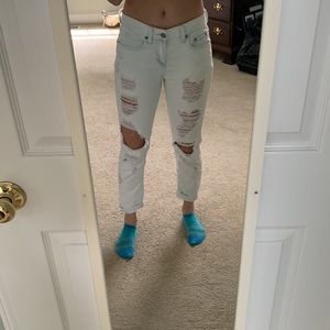 Very light denim/ white low rise distressed mom jean